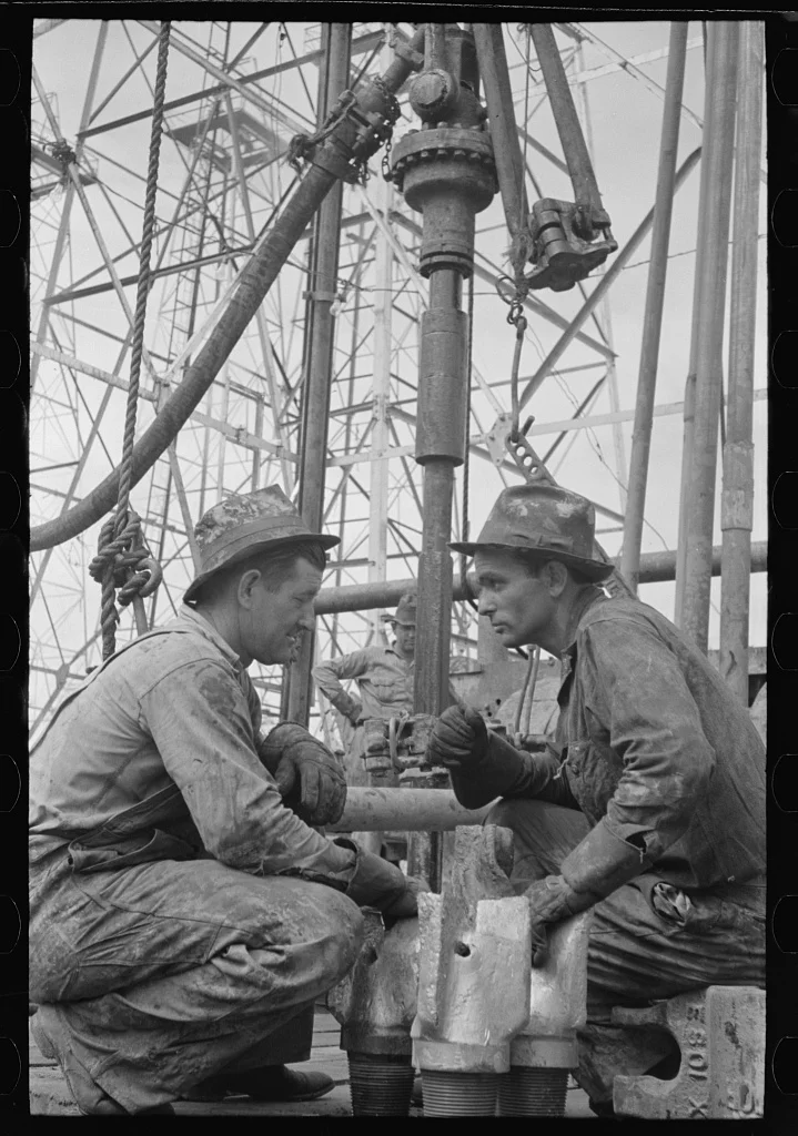 Oil drillers at a well site